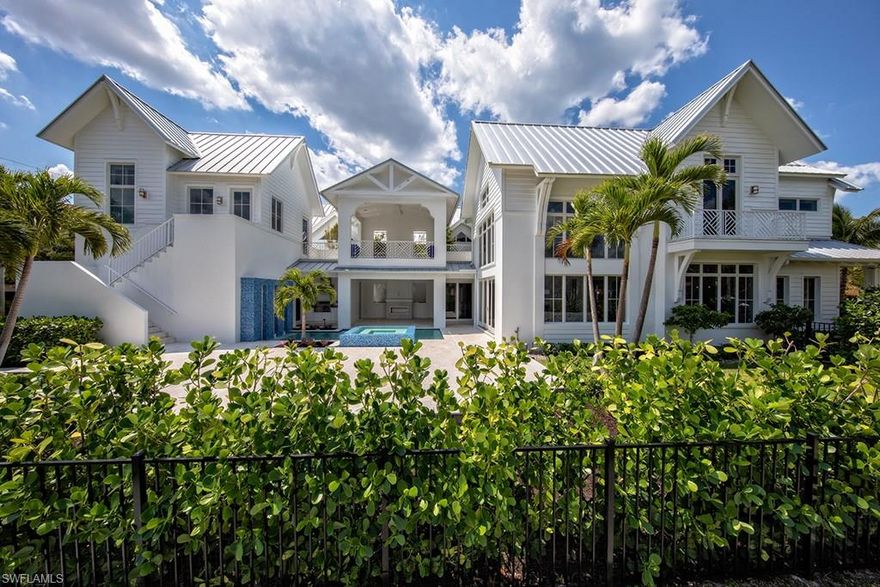 Exceptionally well-located! A short stroll to the famous Naples Beachfront as well as to the excitement of the celebrated cultural, dining, and shopping districts of both Fifth Avenue South and Third Street South. Designed in the timeless architectural style of old Florida, the residence is a modern day portrayal of its historical antecedents equipped with luxurious amenities to satisfy today’s most discerning buyers. The thoughtfully conceived first floor living area is comprised of the spacious master suite, a well equipped kitchen, dining area, and large light-filled great room. Interior living spaces transition harmoniously with the large pool deck and generous outdoor living space, which features an outdoor fireplace and grill area. Three comfortable guest bedrooms are located on the second level, two of which open to a covered second-level outdoor terrace. Ideally situated on a corner lot, residents enjoy abundant green spaces and significant open air entertaining areas adjacent to the pool.