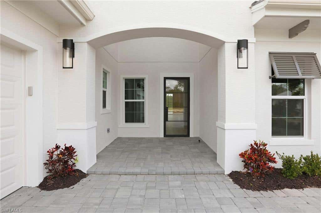 Photo of 9661 Moonflower LN, NAPLES, FL 34114 (MLS # 226027613)