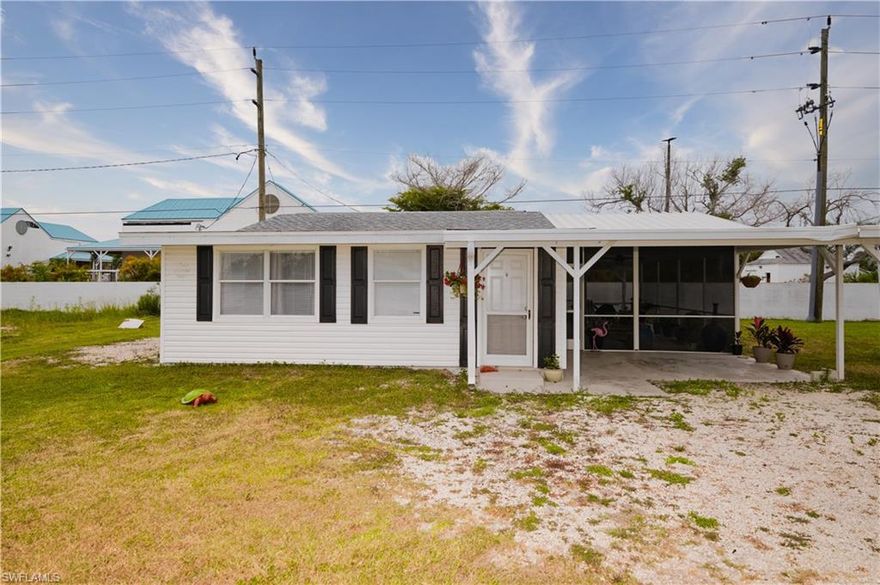 Investor opportunity near some of Southwest Florida's most desirable coastal destinations.  This unique property features two updated residences on one parcel - a charming single family home offering 2 bedrooms and 1 full bath, large lanai for entertaining or just relaxing.  The spacious manufactured home features 3 bedrooms and 2 full baths.  Both homes showcase updated interiors with beautiful kitchens, volume ceilings, oversized windows, and an abundance of natural light throughout.  The manufactured home is currently tenant occupied with a lease in place until July 2027 providing immediate income potential for investors or future flexibility for owner occupants.  Ideally located near Sanibel Island, Bunch Beach, and Fort Myers Beach, this property offers easy access to beaches, dining, shopping and entertainment.  Perfect as an investment property, multi-generational living setup, seasonal or retreat, or future primary residence with rental income potential.