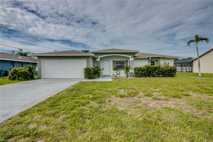 Spacious 3 bedroom 2 bath with large open floorplan and vaulted ceilings.  Screened lanai and large storage shed.  Utilities in and all assessments paid.  OWNER FINANCING AVAILABLE