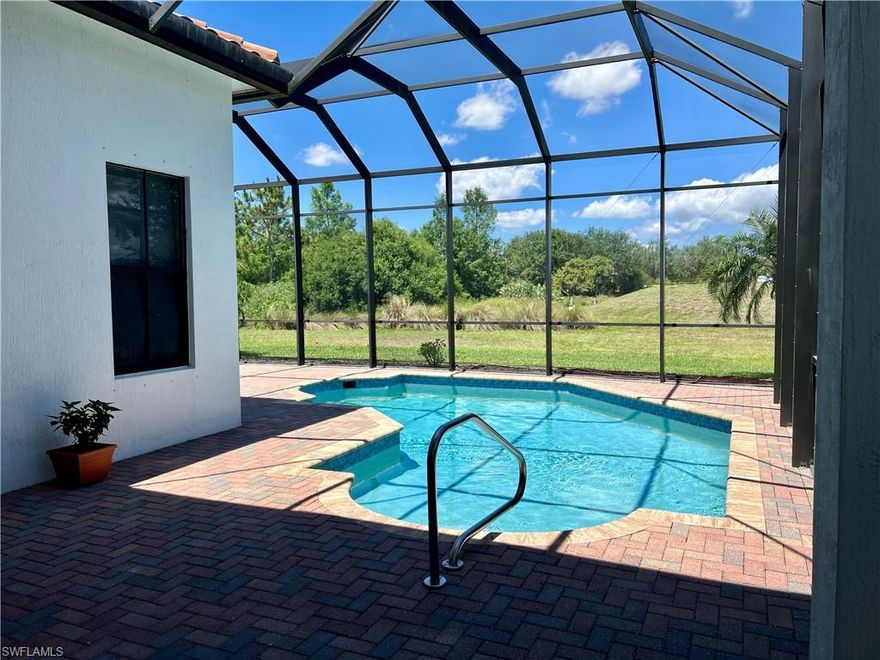 ***THE LOWEST PRICED LONG TERM RENTAL IN AVE MARIA WITH A POOL! *** PETS ARE WELCOME *** And it's ready, just in time for summer! *** AVAILABLE IMMEDIATELY, this inviting ALMANOR floor plan offers comfortable Florida living in the highly sought-after Maple Ridge community of Ave Maria. This ONE-STORY, UNFURNISHED home features 3 BR/2.5 BA/2-CAR GARAGE, and 1,929 sqft of thoughtfully designed living space. Offered as an ANNUAL RENTAL. Step outside to your own private retreat featuring a HEATED, SCREENED-IN POOL and a PAVED LOUNGING AREA—perfect for outdoor dining, relaxation, and entertaining. A berm behind the home and landscaping on the side offer a UNIQUELY PRIVATE BACKYARD setting, rare in the neighborhood. Inside, the home impresses with 12-FOOT CEILINGS and MANY LARGE WINDOWS, creating a bright, open feel throughout. You’ll find WOOD FLOORING in all living areas and bedrooms and the kitchen (no carpet), with tile in the bathrooms. The kitchen is a highlight, featuring GRANITE COUNTERTOPS, STAINLESS STEEL APPLIANCES, and UPGRADED WOOD CABINETS—a perfect blend of style and functionality. The open layout connects seamlessly with the living and dining areas, and the SPLIT-BEDROOM DESIGN provides privacy and flexibility. Located JUST 0.5 MILES FROM THE TOWN CENTER, a convenient shortcut between Ferrari Ave and Taylor Dr makes getting to shops, restaurants, the Ave Maria church, and community events a breeze. As a resident of Maple Ridge, you’ll enjoy full access to the MAPLE RIDGE CLUBHOUSE, which features a resort-style pool, fitness center, event rooms, and more. Don’t miss the opportunity to lease this beautifully located, well-appointed heated pool home in a convenient, amenity-rich community. "Ave Maria: where community meets paradise."