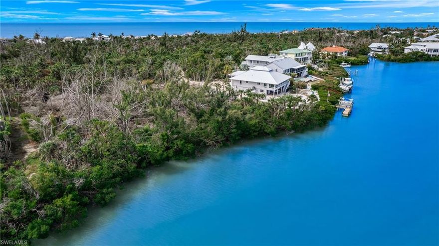 One of the few undeveloped acreage parcels remaining on Sanibel Island, this 1.3-acre lot on the west end has 105 feet of mangrove shoreline along Dinkins Bayou offering wide views of the natural waterway, which is home to birds, fish, and the occasional manatee. The tidal, saltwater bayou connects to a blind pass with no bridges to restrict you from the deep waters of the Pine Island Sound and the Gulf. The lot's desirable southwest exposure ensures sun on your pool all year long and gives the added benefit of sunset views over the bayou. Whether by boat or bike, you are just minutes away from the incredible shelling at Blind Pass Beach. Seller commissioned the complete design of three different sets of fully detailed house plans that are ready for permitting after final engineering. Seller also invested significant time and money into the necessary due diligence for this property including contracting for the preparation of a recent construction survey and all necessary soil testing. Survey and analysis of soil composition are attached. In addition, the seller had the lot cleared all invasive Brazilian pepper which will save the buyer time and money when they apply for a building permit. Survey estimates 14,020 of impervious coverage and 16,824 total coverage.
