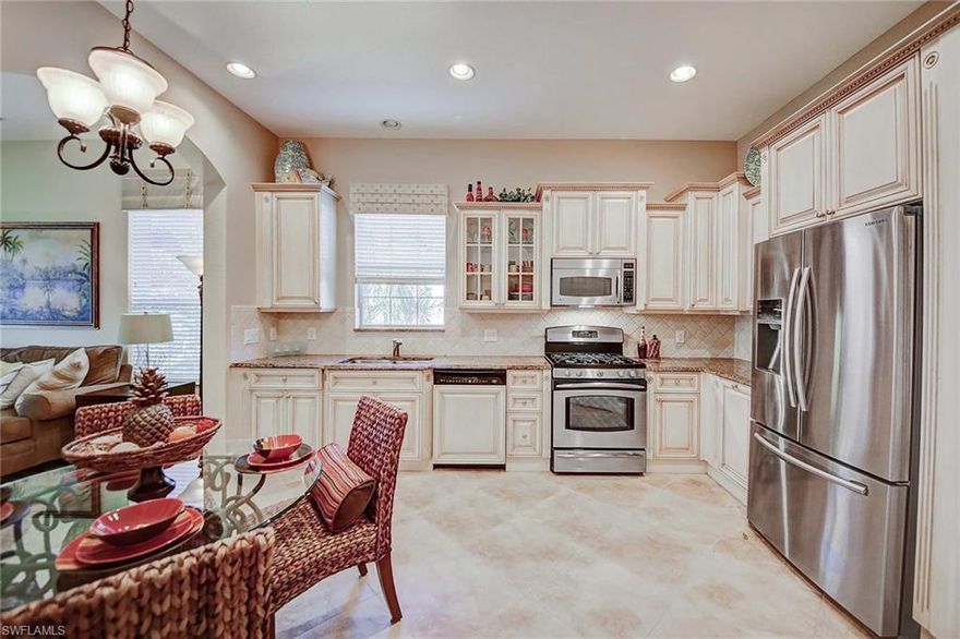 Take pride in owning this delightful and welcoming second-floor home with tasteful upgrades. A beautiful wood staircase leads up to an open and bright floor plan. The home is equipped with an elevator for ease and comfort. A combined dining and living room allows lots of natural light. The kitchen features stainless steel appliances, pleasing light wood cabinetry, large pantry and gas cooking. The master suite provides dual walk-in closets. Relax in the spacious master bath with private water closet, dual sinks and soaking separate tub and shower. New a/c installed Nov. 2016. Take in the westerly sunset skies from the screened-in lanai. What a perfect spot for entertaining! This home and the much sought-after community it’s located in are in the well-established and healthy community of Fiddler’s Creek, offering many resort-style amenities, some of which include several dining options, pool, club and spa with full fitness and tennis and much more. Golf and beach memberships are available.