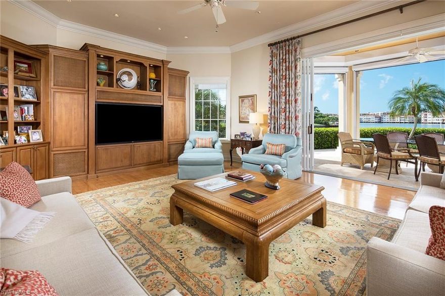 Commanding southwestern views of Venetian Bay are the focal point of this impeccably maintained British West Indies estate. Sprawling over 100ft of water frontage, the luxurious pool and spa overlooks the glistening waters of the Bay and beyond. Be captivated by sunsets in either the expansive pool area and surround or the gracious upstairs enclosed balcony. Countless upgrades bring this gem to the highest standards to include but not limited to; roll down shutters, Lutron lighting, recently updated AC units, 3 car garage and timeless finishes throughout. Perfectly situated on one of Park Shore's most desirable streets, homeowners are just a short stroll from Venetian Village and the Park Shore Beach association.