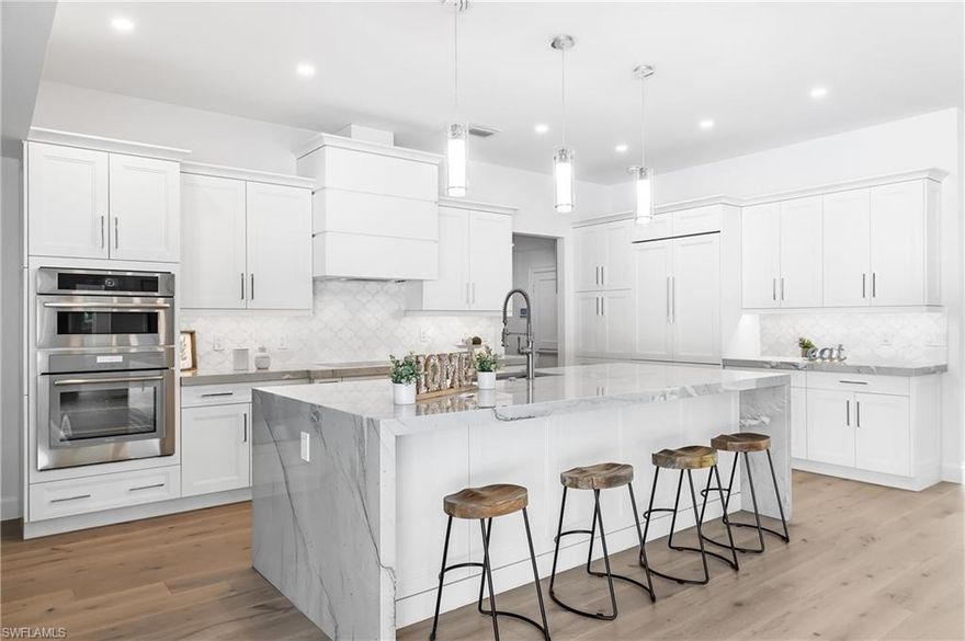 Essentially BRAND NEW .38 acre western exposure home located in the X flood zone of the Moorings. This luxury home that was completely renovated down to the studs includes 4 bedrooms + den/office, 3 full baths and approximately 2,850 square feet. Brand new metal roof, raised ceilings in living area, new impact garage door, new water heater, impact windows, 90 degree PGT slider looking out to the resurfaced pool with extended travertine deck & all new lush landscaping. Enjoy both a split floor plan and an open kitchen concept with beautiful French oak floors, Kitchen Craft cabinets, Miele induction cooktop, Décor fridge and a Mont Blanc waterfall island with Quartzite countertops throughout. For garage lovers, this oversized garage can easily fit three cars or two with a golf cart and room for storage. Integrated security system with ring doorbell, perimeter cameras, & wifi controlled thermostat. Smart TV, soundbar with indoor and outdoor speakers for open air year round entertainment. Moorings Beach pass eligible with a short walk to shops and restaurants... A short ride to the Naples Pier, Tin City, downtown Olde Naples & Venetian Village shops; this truly is the perfect location!