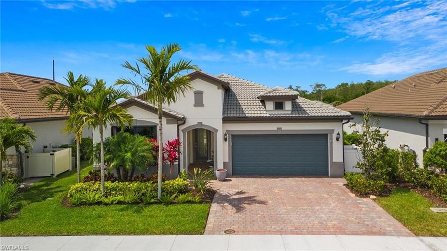 Prepare to fall in love with this Abbeyville plan pool home the moment you step inside. The hurricane glass front door hints at the luxury and functionality that awaits. NO DETAIL has been overlooked. This stunning 2Bedroom + Den, 2 Bathroom home is loaded with upgrades. Take note of the CUSTOM WALL TREATMENTS, crown moulding, 8 ft doors, recessed lighting and plantation shutters to name a few. The Den with French doors offers a quiet space to work from home. The Kitchen features white cabinets, quartz countertops, gorgeous tile backsplash and a large island for entertaining. The Living Room has expansive windows overlooking the custom pool and your own outdoor oasis. Relax on the spacious lakeview lanai and enjoy the pool and waterfall. You'll appreciate the beautifully landscaped yard from the sunshelf. The Main Bedroom showcases oversized windows with cellular shades. The ensuite Bathroom boasts a tile wall and luxurious closet with it's own ceiling fan! A 2nd Bedroom and Bathroom are set apart for optimal privacy for your guests. Peek into the Laundry Room with extra storage space, cabinets and a sink. With upgraded carpet and high-end ceiling fans and light fixtures, this house has been meticulously designed with style in mind. Don't miss the garage with epoxy flooring, pull-down stairs to attic storage, wall cabinets and overhead storage. Bridgetown amenities include a resort style pool, chilled lap pool, bocce, pickleball, tennis, bbq/fire pit picnic area and a state-of-the-art fitness center.  Don't miss your chance to own this incredible property in Bridgetown - schedule a showing today!