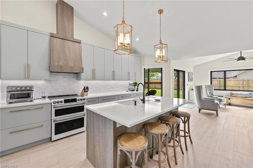 This fully renovated single-family residence has been thoughtfully redesigned with everyday living, entertaining, and safety in mind.

The completely reimagined kitchen serves as the heart of the home, featuring custom cabinetry, quartz countertops, a large island, GE Café Series appliances (2022), a custom vented hood, generous pantry storage, and a dedicated coffee bar for added convenience.

Throughout the home, plank-style porcelain tile flooring creates a seamless, modern look, complemented by downlighting in every room and plantation shutters for both comfort and style.

The primary suite offers a private retreat with direct access to the expanded lanai, a beautifully updated en-suite bath, two custom-designed closets, and remote privacy shades for added comfort and convenience.
Additional guest bedrooms provide flexibility for family, visitors, or a home office, while the guest bathroom has been fully renovated with a Kohler cast iron tub.

Beyond aesthetics, the home offers exceptional peace of mind with extensive upgrades throughout, including NEW ROOF 2024, NEW PLUMBING 2024 (FULL REPIPE), NEW ALLINI WATER FILTRATION SYSTEM, NEW PAINT INSIDE AND OUT 2024, NEW AC AND DUCTWORK 2024, UPGRADED ELECTRICAL 2024, NEW IMPACT WINDOWS AND DOORS THROUGHOUT 2024, and a NEW HURRICANE-RATED CUSTOM GARAGE DOOR 2025, along with new insulation (2024), interior doors, trim, and additional thoughtful improvements designed for long-term reliability.
Functionality continues with a well-appointed laundry area featuring a mudroom-style setup and utility sink, along with epoxy-coated garage floors that provide a clean, durable, and polished finish.

Step outside and experience a property designed for gathering and enjoying the Florida lifestyle. The expanded lanai flows seamlessly into a NEW EXPANDED LANAI and outdoor living space featuring a NEW BUILT-IN OUTDOOR BAR with seating for four, a firepit area, and a spacious backyard with room to add a large pool. The NEW CIRCULAR DRIVEWAY, walkway, and rear patio elevate both curb appeal and functionality, while fresh landscaping and low-voltage lighting create a warm, inviting setting day and night.

This home has truly been a place for connection and celebration, offering ample space to host everything from relaxed evenings by the firepit to larger gatherings, with room for outdoor entertainment, bounce houses, and even a temporary pool setup for family fun.

Boca Palms offers residents a gated entrance, community pool, tennis and pickleball courts, and is located within a highly regarded school district. Just minutes from Naples’ white sand beaches, shopping, dining, and entertainment, this location delivers both convenience and lifestyle.

This is a rare opportunity to own a move-in-ready home where the hard work has already been done.