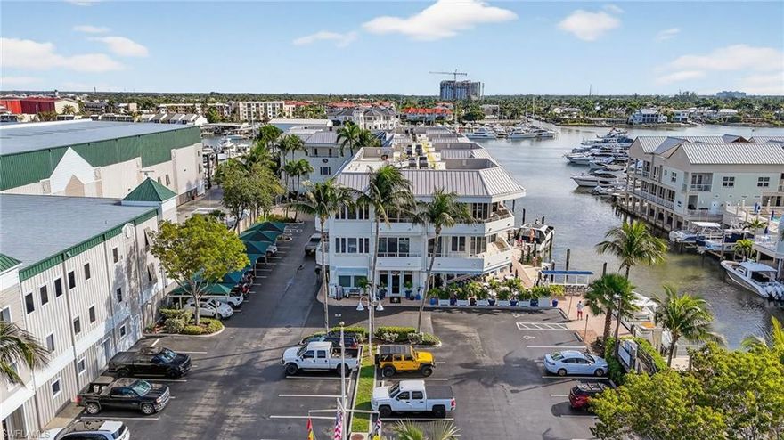 Set within prestigious Naples Boat Club, this rarely available residence offers an exceptionally rare waterfront front-row position to Olde Naples' most coveted boating lifestyle. Boaters as well as non-Boaters make this home.  Waterfront residence on westside of  Naples Bay offers direct Gulf access, for the avid mariner.  Spacious and light-filled open floor plan with ample cabinetry, wet bar, generous bedroom suites, and multiple access waterfront terraces. Primary suite offers bay views, large bath, and distinctive indoor garden room. Two guest suites with en-suite baths and terrace access, plus large powder room for day guests. Great home for entertaining , relaxing, or just enjoying the Naples lifestyle.
Community amenities include a newly renovated bayside clubhouse, heated pool, chickee bar with grill, pump-out, wash/service racks, fish-cleaning station, on-site management 7 days/week, and marine services available. The handy Syren Oyster & Cocktail Bar, with indoor and outdoor seating, lines the walk along the docks. Fuel is available next door at Naples City Dock. Walk to The Boathouse Restaurant, downtown Olde Naples, Bayfront, Tin City, and multiple waterfront restaurants. Minutes to the Gulf by boat or walk to the white sandy popular beaches of Naples.  Residents enjoy the gated building entry, elevator, pet-friendly status, and maintenance-free living. Includes one space in under building enclosed garage, plus a covered carport. Some images are virtually staged.