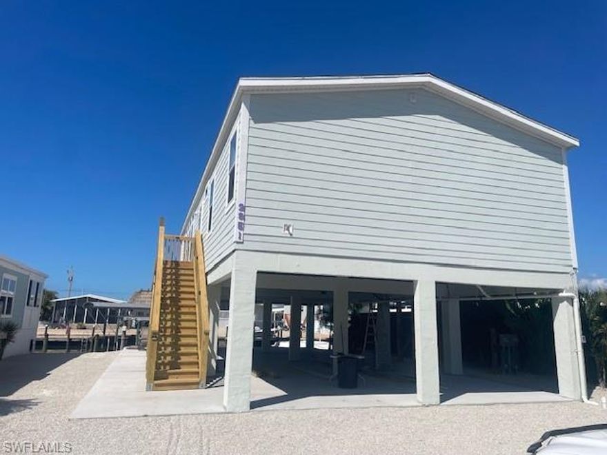 Discover true island living in this brand-new 2026-built home, available for seasonal rental March, and April of 2026. Located in the desirable Cherry Estates community of St. James City, this beautifully furnished 2-bedroom plus den, 2-bath residence sits on a direct Gulf-access canal just minutes to Pine Island Sound and the Gulf of Mexico—a dream setting for boaters and anglers alike. Enjoy effortless water adventures with the private boat lift available for your use, perfect for exploring world-class fishing grounds or taking a scenic cruise through the islands. End your days soaking in beautiful sunset views from the porch, overlooking the canal and peaceful island surroundings. Inside, the home features a bright, open great-room layout, modern finishes, tray ceilings, and comfortable coastal décor designed for relaxation. With quick access to pristine waters, incredible fishing, and the laid-back charm of Pine Island, this stunning new home offers the perfect seasonal escape for those seeking the best of Southwest Florida’s island lifestyle.