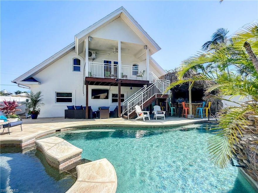 PRICED TO SELL NOW! Are you ready for this fantastic investment opportunity? This Fort Myers Beach Luxury Beach home has been remodeled and completely upgraded from top to bottom. Move in ready! Perfect for a vacation rental or private get away. Added3rd Bedroom & Half Bath in Laundry Room. Relax in your expansive Master Bedroom Suite with French Doors leading out to your private deck overlooking the pool and spa! New Kitchen Cabinets and countertops, appliances, furniture, security system, hurricane Impact windows, heated saltwater pool and hot tub, New tankless water heater, New HVAC, New ROOF, New Paint inside and outside. Added TIKI Bar outside by the pool, Outdoor sound system oversized pool deck. More TV's than your local sports bar! No need to be stuck in traffic. This home is a short bike ride and walk to Times Square shopping and restaurants on the north of the island and a 6-minute walk to the beach. This home is an active vacation rental in a turnkey rental program.