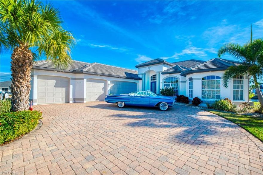 Premier Luxury Waterfront Estate | 235’ Frontage | Unique Corner Lot | River Access Experience exceptional luxury waterfront living with approximately 235 feet of water frontage on wide intersecting canals, just minutes to the river with sailboat access and no bridges. Ideal for the true boating enthusiast, the property features two boat lifts, a jet ski lift, and a rare wraparound dock accommodating multiple vessels, including yachts up to 50 feet. The home offers impressive curb appeal with a grand entry, four-car garage, and elegant paver driveway. Fully renovated in 2021, it showcases a new designer kitchen, upgraded flooring throughout, custom pavers, and a beautifully updated pool deck. Lush tropical landscaping and mature coconut palms create a private, resort-style setting. A rare opportunity to own a premier deep-water estate in the highly desirable Yacht Club area.
