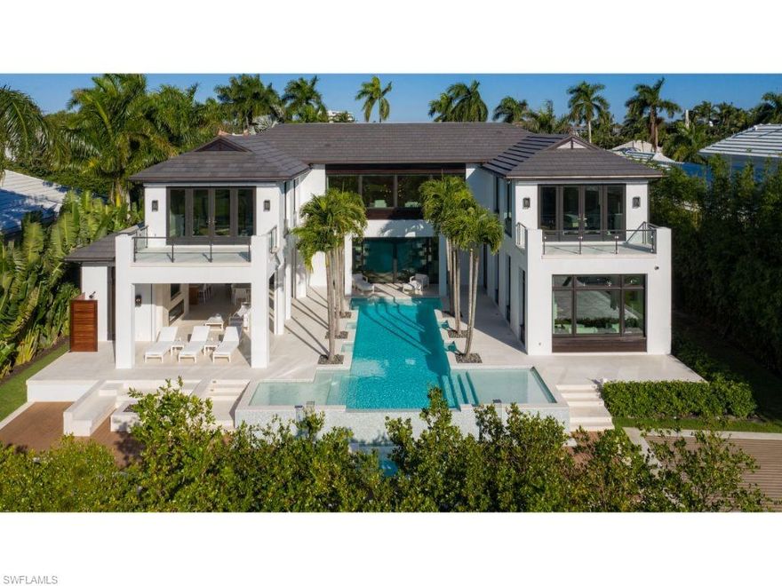 New and never lived in! The owners have spent the past year thoughtfully and meticulously enhancing this exceptional home and property. Creatively designed by Kukk Architecture & Design, P.A. and constructed by A. Vernon Allen Builder, Inc., the property represents the pinnacle of modern day conveniences and luxuries. Recent improvements are too numerous to list. The large kitchen and spacious great room open seamlessly beyond the large “lift and slide” doors to abundant outdoor space, offering both covered and uncovered areas for social gatherings. When seeking respite, residents and guests will enjoy the 6 private bedrooms (one currently being used as an exercise room with sauna) and an office. Highly desirable southern exposure. 4 car garage. Located in close proximity to the excitement of Third Street South. Quick access to Naples Bay and the estuarine waterways by boat.