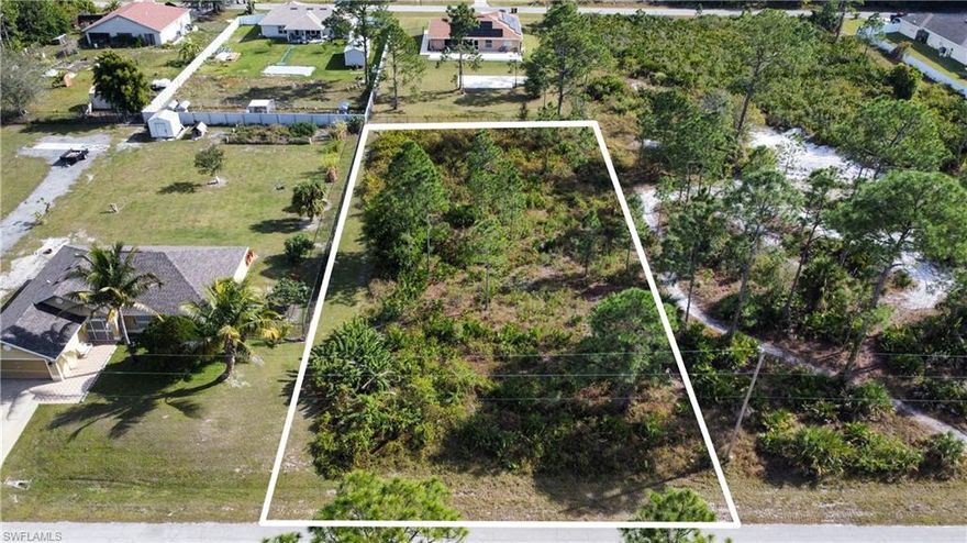 Nice, Big, buildable Lot located in central Lehigh Acres. Nice homes are going up all around.