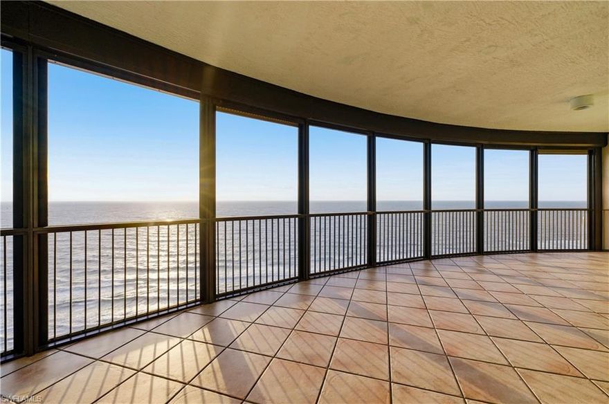 Experience elevated beachfront living in this exceptional penthouse residence, set on the 20th floor of The Remington, one of Florida’s most distinguished beachfront addresses, with sweeping panoramic views of the Gulf. Moments away are the renowned amenities of The Ritz-Carlton Naples – Beach Property, the Bay Colony private beach club, and the Bay Colony Tennis Club, with residents enjoying exclusive access to select Ritz-style services, including room service and concierge support, via a private entrance that seamlessly blends five-star hospitality with private condominium living, all within close proximity to dining, beach access, and a vibrant coastal atmosphere. This sought-after floor plan offers approximately 3,390 square feet of interior living space and 4,200 square feet total. The serene primary suite features floor-to-ceiling glass sliders opening to the screened balcony with breathtaking Gulf views, a spa-inspired bath with dual vanities and a jetted soaking tub, and an oversized walk-in closet. Two additional en-suite guest bedrooms enjoy beautiful views of the Naples area, tennis club, and Ritz pool, each with access to a second screened balcony. Natural light fills every room through floor-to-ceiling sliding glass doors, complemented by electric storm shutters on both screened balconies for convenience and peace of mind, while newer hardwood floors enhance the main living areas. The Remington has been thoughtfully renovated, with interiors reflecting understated elegance reminiscent of the Ritz, and is impeccably managed with attentive, concierge-level service and comprehensive security from the guarded entry gate to in-building services. Amenities include a refined social room, a state-of-the-art fitness center with private sauna, a resort-style pool, and an outdoor dining area with grills, fire pit, and private cabanas owned by select residents. Located within Bay Colony—one of Naples’ most coveted and ultra-private communities—residents enjoy access to golf, fine dining, tennis, and a private beach, while this meticulously maintained residence remains a premier offering, with a private cabana owned by the seller also available for purchase, presenting a rare opportunity to own a timeless beachfront penthouse in Pelican Bay, at the heart of Bay Colony.