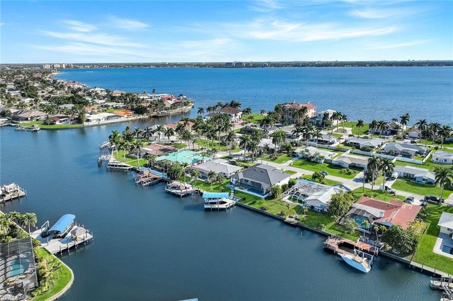 Rare opportunity in one of Cape Coral’s most sought-after waterfront neighborhoods. This direct sailboat-access property sits just one canal from the river with no bridges, offering quick and easy access to open water. Located minutes from the Yacht Club and surrounded by luxury waterfront homes, it’s an ideal setting for boaters, investors, or those planning a future custom build. The existing structure was impacted by Hurricane Ian, offering a prime opportunity for renovation or redevelopment. Enjoy deep-water intersecting canal views and a concrete dock. Centrally located near Downtown Cape Coral, Cape Harbour, and Tarpon Point, with Sanibel, Captiva, Fort Myers Beach, shopping, dining, medical facilities, and top-rated schools all within a short drive. Whether you choose to renovate, generate income, or build your dream waterfront home, this property offers exceptional flexibility and long-term potential in a premier boating community. Call to schedule your private showing today!