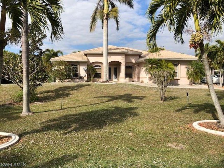 If fishing is your DREAM, then take a LOOK at this one. Perfectly situated on 1 acre in the middle section of Pine Island and only 10 minutes to open waters and some of the best FISHING in the world!!! This home was built by an  Engineer, solid and sound. Volume ceilings throughout, plenty of windows, tile roof, newer AC and water heater, open floor plan, 2 MASTER SUITES and guest bedroom, 3 full baths and a home office/den. Tile throughout the main living areas, carpet in 2 bedrooms, huge closets in all rooms, walkin pantry off the large laundry room, both master bath have tiled walkin showers and heat lamps. The oversized garage has tile flooring and plenty of workspace. Come be one with nature and feed your soul sitting by the bubbling pond under the swaying palm trees, 128 palm trees and one of the best producing MANGO trees around. Did I mention you have your own BOAT ramp on the property!!! Relax on your SCREENED lanai and listen to the FISH jumpin.....at deadlow tide 3.5ft deep