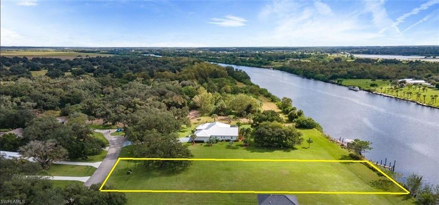 This stunning riverfront homesite is truly a rare find—one of only two vacant riverfront lots in the entire community! Enjoy breathtaking panoramic views of the Intracoastal Caloosahatchee River and build the home of your dreams with direct deep-water access to the Gulf, Atlantic Ocean, and Lake Okeechobee right from your backyard.

Riverbend is a true hidden gem—nestled just outside the city limits, yet offering the peaceful feeling of being worlds away. From its majestic oak-canopied entrance and double-gated security to the community pool, clubhouse, and tennis court, this neighborhood has it all. The low monthly HOA fee of just $330 includes all these amenities plus lawn maintenance, water, sewer, irrigation, and even a storage area for boats and RVs.