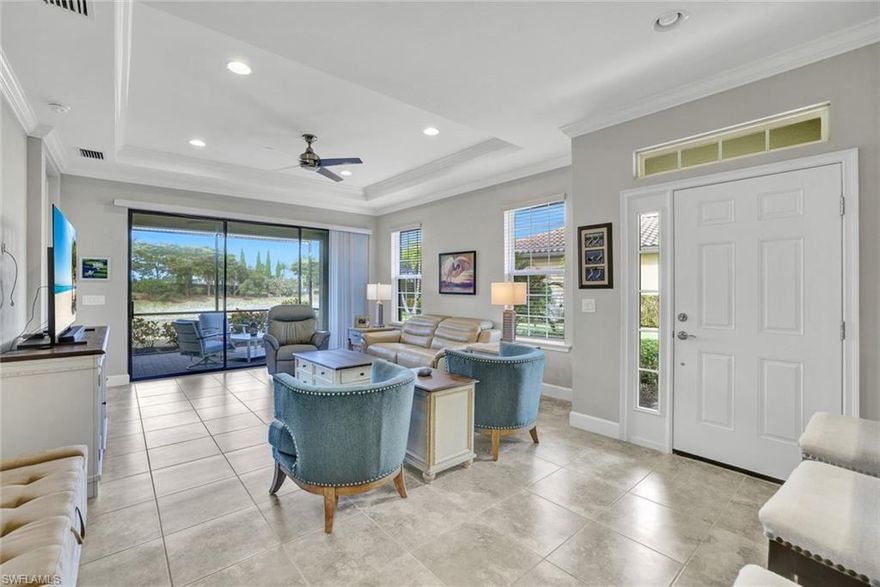 Located on a quiet cul-de-sac in the sought-after Esplanade at Hacienda Lakes, this attached villa, formerly a Taylor Morrison model, is perfectly positioned on an extra-large lot that offers exceptional privacy and a serene lake view. Designed for easy Florida living, the home features refined finishing, tile flooring throughout, crown molding, and an open, light-filled layout that flows seamlessly to the extended lanai—ideal for relaxing or entertaining while enjoying the peaceful water backdrop. Offered turnkey furnished, the residence is move-in ready and thoughtfully appointed. The kitchen is equipped with a gas stove, crisp white cabinetry, and a layout that opens to the main living areas. Additional highlights include a spacious laundry room with sink and extra cabinets, a gas dryer, and a tankless water heater for added efficiency. The private primary suite features a generous walk-in closet and an en-suite bath with a walk-in shower. With its oversized lot, plus room for a pool and a beautiful lake view, this villa offers a rare combination of privacy, comfort, and resort-style living in one of Naples’ most desirable communities.