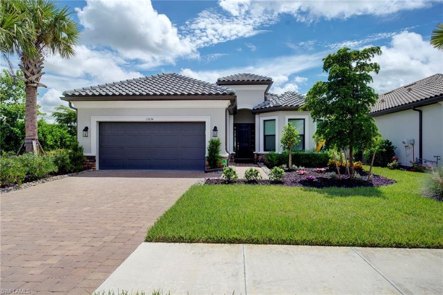 This is a rare opportunity to own an original Lazio model, giving you immediate access to the world-class resort-style community of Esplanade by the Islands. Featuring the larger Lazio floorplan and bigger lot - no longer offered in new builds within the community. Enjoy over 2440 sq ft of living space with 3 bedrooms plus den, 3 full baths, 2 car expanded garage, and a corner lot with stunning water views. The open and airy layout features an upgraded gourmet kitchen designed for entertaining complete with GE Café appliances, quartz countertops, a wine fridge, an extended breakfast area, and loads of storage cabinetry in the oversized center island. The luxurious primary suite offers water views and a spa-like bath with a large glass shower, quartz countertops, and a custom California Closet. Thoughtful design details abound. Elegant bay windows in both the primary and guest bedrooms, tray ceilings, designer lighting, and a dedicated study appointed with French doors. The private guest suite offers an en-suite bath and a walk-in closet equipped with custom California Closet systems. Enjoy the convenience of the oversized laundry room with cabinets, upgraded washer & dryer, and laundry sink. Additional enhancements include impact windows, upgraded landscaping, a mini-split A/C system in the garage, Storm Smart hurricane shades on the lanai, prewired for pool/spa, and rough-in for an outdoor kitchen. The deep 150’ lot provides an exceptional opportunity to design your dream outdoor sanctuary, whether it's a pool or a further expanded lanai. Just minutes from Marco Island, downtown Naples, and the Gulf’s renowned beaches, Esplanade by the Islands offers a vibrant lifestyle with a private clubhouse, restaurant, tiki bar, spa, fitness center, dog park, walking trails, tennis, pickleball, and the additional amenity center opening later this season. All of this is offered with the added benefit of low HOA dues.