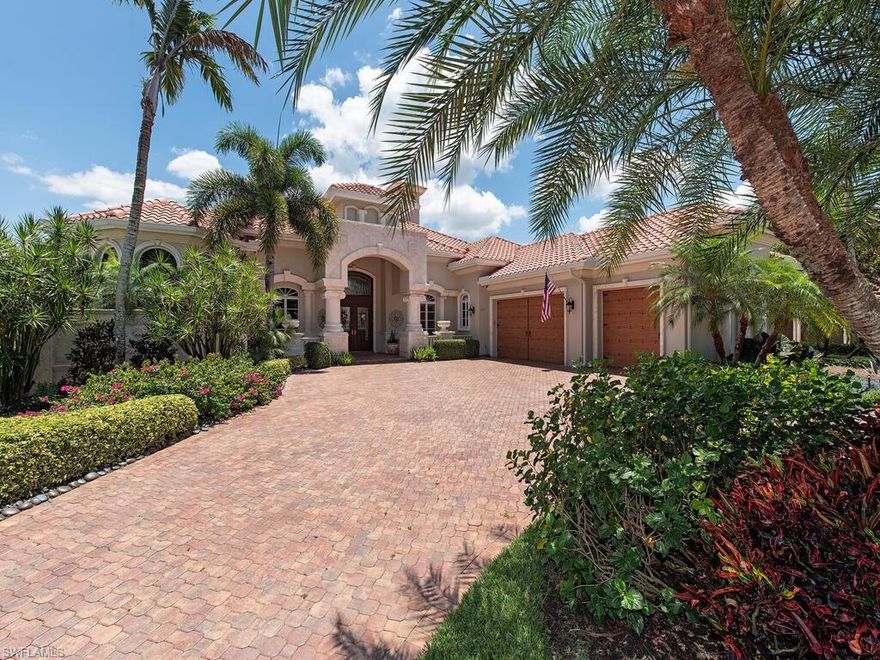 This distinguished estate home in The Vineyards most desirable subdivision Venezia Grande Estates is a tropical oasis set on a double golf course and lake view lot. Quality and elegance awaits you upon arrival in this 4 bedroom plus den, 4.5 bath home.  Enjoy the finest of outdoor living areas in a tropical paradise that includes a newly remodeled pool and spa, outdoor kitchen, 2 outdoor satellite patios, fireplace, new screen enclosure and spacious covered patio. This tasteful Bellagio floor plan has a generous master suite including walk-in his/her closets, a walk thru shower, his/her water closets and a large sitting area off the bedroom.  The remodeled kitchen offers gas appliances, island countertop and a large breakfast bar that spills over into an open family room designed for entertaining.  3-car garage, 2 fireplaces, new wood flooring, generator, freshly painted interior and exterior and new electric storm shutters are part of a $200k plus renovation.  There are 3 guest rooms all ensuite and a pool bath. Vineyards offers 36 holes of golf, upscale dining, full service spa, wellness center, tennis, pickleball and a resort style pool and poolside dining.