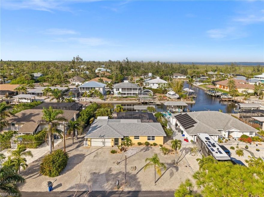 IT'S 5:00 SOMEWHERE!!! This tastefully remodeled 3 bed, 2 bath pool home is the perfect vacation/full time home for those looking to enjoy all that the Florida lifestyle has to offer from boating, kayaking and some of the best fishing in SW Florida. For the boating enthusiasts, enjoy a boat ride to the beaches of Fort Myers, Sanibel or Cayo Costa from the Direct Gulf Access Canal right in your back yard with composite dock, boat lift and jet ski lift!! Wait, there's more....you have access to deeded land across the street for additional parking for your RV, boat or guests. For investors out there, this property has been a successful vacation rental for the past 5 years.