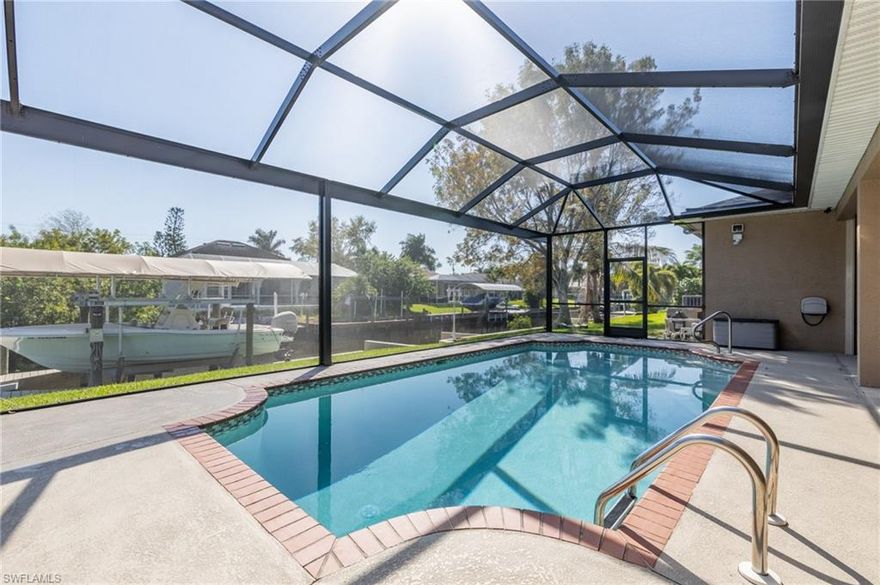 Be sure to view virtual tours for more information!! Excellent home, convenient location, less than 20 min to river- only bridge is MidPoint. Motivated seller!!! Featuring a split bedroom floor plan, w/ a den next to the master- and the best closets in SWFL! Pool (refinished in '19) offers an outside bathroom & lots of room under truss.  Main living area boasts gorgeously laid tile, stately crown molding & quality fixtures through out. Custom closets & cabinetry everywhere, including the 3 car garage (Swisstrax flooring).  Wood burning fire place. Newer appliances in kitchen. Fully protected, including: 20 security cameras (w/internet capability) motion detecting solar lights on the outside of the home, High Impact Hurricane windows/glass sliders & Storm Smart automatic roll down storm shutters. 2018: New Roof, Gutters, Pool cage/screens. AC in 2017. Water heater 2015.  200 amp surge protector built into the electrical. 8,000 boat lift . Back of home has separate UNDER AIR (13' x 6') secure utility room/man cave, or private owners storage (which would be perfect for vacation rentals). Convenient access to the MidPoint Bridge, makes commuting into Ft Myers a breeze. Don't Delay!