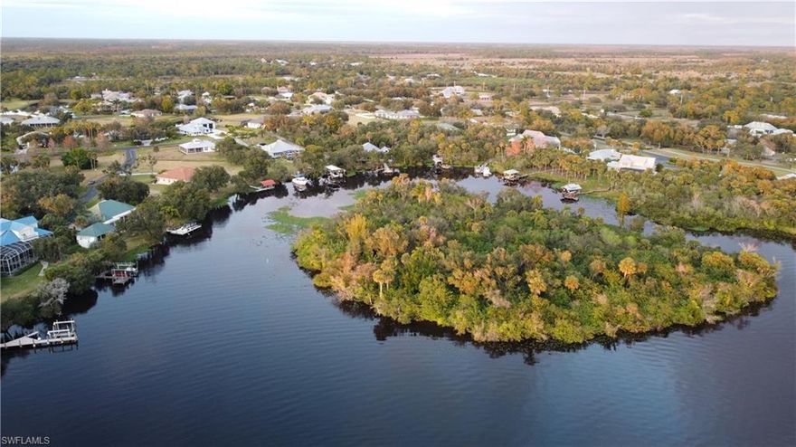 OVERSIZED RIVERFRONT! 
In Riverwind Cove - a premier boating and equestrian community nestled along the scenic banks of the Caloosahatchee River. This nearly one-acre riverfront lot is cleared, build-ready, and offers deep-water frontage with stunning views of a private island just across the river.

A private boat dock on a gentle river bend provides direct access for boating, fishing, and waterfront living at its finest. The southern exposure is ideal for filling your future custom home with natural light while creating the perfect setting for a pool, outdoor entertaining, and sunset lounging.

Equestrian-friendly living sets this community apart—bring your horses, with access to community stables for boarding. Tucked away from heavy traffic yet conveniently located near SR 31, SR 80, and Interstate 75, this location also offers easy access to W.P. Franklin Campground and Babcock Ranch.

Oakview Circle captures the essence of Old Florida charm, framed by moss-draped live oak canopies. The only riverfront lot currently available in Riverwind Cove—a truly rare opportunity to build your dream waterfront estate.