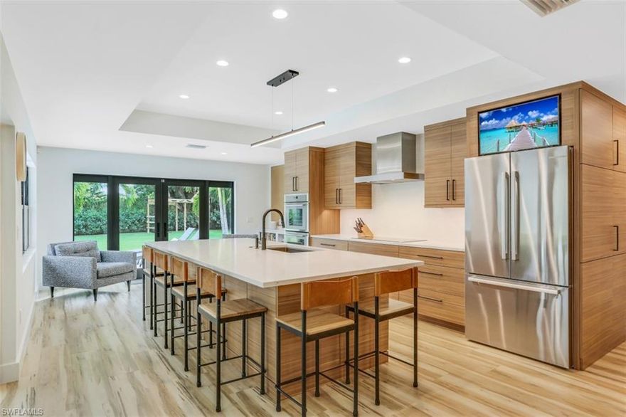 H3890-This .35 acre southern exposure home was carefully redesigned into a modern masterpiece that looks and feels brand new.The kitchen is gorgeous with flat paneled cabinetry, quartz countertops, tons of drawers, a huge center island with plenty of storage, a double wall oven and induction cooktop (Thermador and Bosch appliances).Indoor/outdoor entertaining is a breeze with access to outside from all main living areas and primary bedroom.The home features new plumbing, electrical, ductwork, AC w/ whole house dehumidifier, raised ceilings, new smooth coat drywall and custom closet and pantry systems. All openings are impact rated. Outside, there is a newly designed driveway, zoysia grass landscaping & all new irrigation. The pool was refreshed (resurfaced, new pool equipment, shellstone pavers, heavy duty lanai screens, backyard fence & a custom Ninja course!).The seller spared no expense making this a SMART home, with cat 5 wiring in every room and hard wired TV's for faster streaming.You can control the pool, security system and door locks remotely from your device.Close to shops and dining. Eligible for Park Shore Beach private membership, SeaGate, Gulfview Middle, Naples High.