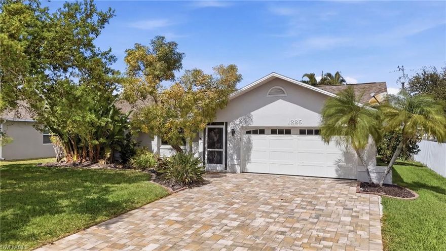 This 3 bedroom pool home is located in a quiet, established neighborhood in one of Cape Coral’s most convenient locations near schools and just minutes from either bridge, shopping, and dining. This home feels like the perfect mixture between updated, and character that you can make your own. With a vaulted ceilings and a spacious split floor plan containing multiple living areas, this home is perfect for your growing family. The open kitchen features quartz countertops, upgraded appliances, soft-close cabinets, and a pass-through window with a view of the serene pool area. Three sliding glass doors lead out to the screened pool area, creating great indoor-outdoor living. The primary suite includes a walk-in closet, a glass slider to the pool, and a beautifully updated bathroom with glass door shower, tile finishes, and dual sinks. A convenient pool bath with a whirlpool jetted tub provides direct access to the outdoor area.The private backyard is fully fenced and lined with mature clusia plants for added privacy. The extended paver driveway (2024) provides additional parking and curb appeal. Major updates include:Roof (2023) A/C (2019) Re-plumbed with CPVC (2016) New water heater (2024), Impact windows and doors throughout, New pool light and pool equipment. This is a fantastic opportunity to own a pool home with major updates already completed in a highly desirable Cape Coral location.