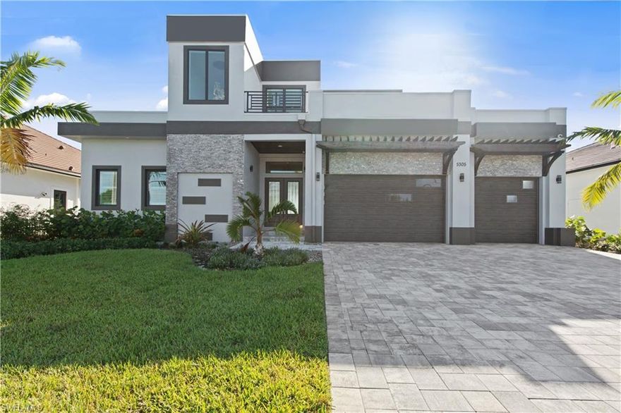 This contemporary home was custom-built in 2021 and is located within the prestigious SE Cape Coral. With direct sailboat access to the Caloosahatchee River or the Gulf of Mexico. It's the epitome of luxury “Salt Life” living! Professionally designed open-concept living features high ceilings adorned with elegant coffers & rich trim. Porcelain floors flow throughout the living space, and zero-edge pocket sliders provide stunning canal views. A gourmet kitchen features brilliant blue base cabinets & crisp white upper cabinets. It is perfectly adorned with Quartz Calacatta Monticello countertops. Any chef will appreciate the large island with tremendous cabinets. An oversized wine display case, beverage fridge, and stone backsplash set this kitchen off as one the best we have seen. The 4,380 Sq Ft home includes a primary suite with his and hers boutique closets, with a luxurious master bath. 3 guest ensuites, 2 bedrooms, and 2 bonus rooms. Outdoor entertaining space has covered & uncovered space, a grill area with multiple seating areas. Dock completed November 2022 and is ready for your preferred watercraft. Enjoy year-round, secondary home, or income-producing vacation rental.