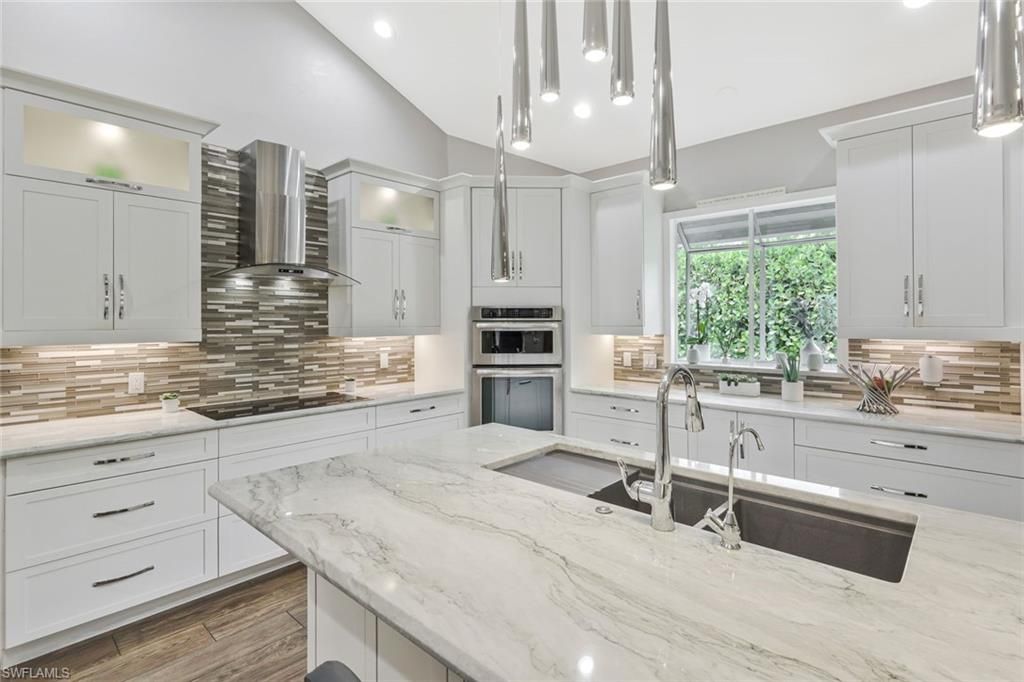 Photo of 730 BAY TREE CT, NAPLES, FL 34108 (MLS # 226011964)