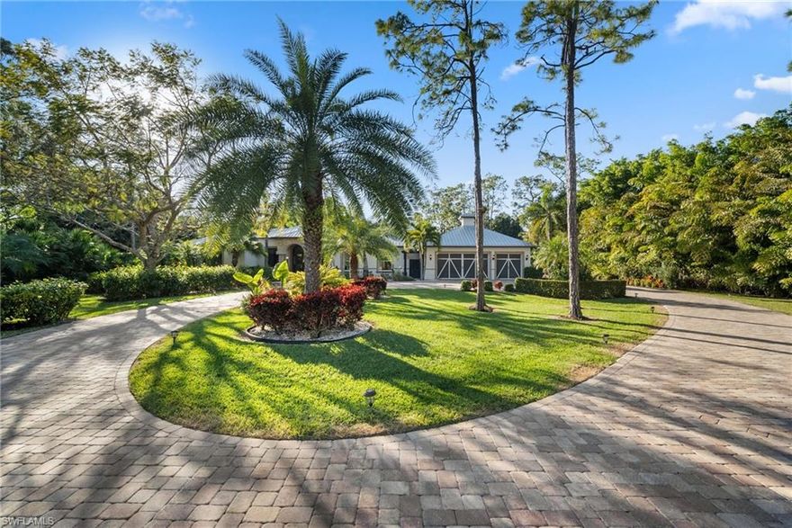 A Rare Opportunity to Own 5.77 ACRES of Estate Living Close to Downtown Naples: This extraordinary, custom-built Florida home offers a rare opportunity to own a sprawling 5.77-acre estate just moments from the vibrant heart of downtown Naples. With its private gated entrance, this residence provides a serene and expansive environment perfect for those seeking both luxury and convenience. Designed for casual estate living, this spacious home features four large bedrooms plus a den, four full bathrooms, and one half bath. The 32’ x 22’ entertainment room offers ample space for hosting gatherings, while an in-law apartment with its own kitchen, full bath, walk-in closet, and screened balcony provides comfort and privacy for guests or extended family. Exquisite Design and Luxury Features: The interiors boast stunning custom details throughout, from elegant wood finishes to beautiful crown molding and upscale fixtures. For wine enthusiasts, the home includes a wine cellar, ensuring your collection is stored with the utmost care. The oversized lanai is a true highlight, offering a stunning setting for outdoor living. Whether you're relaxing by the gorgeous pool and spa, enjoying meals from the outdoor kitchen, or simply taking in the tranquil views, this space is designed to impress. With plenty of room to accommodate family, guests, and gatherings, the home offers a perfect balance of comfort and functionality. A Private Sanctuary and Ample Space for Outdoor Living: This fully fenced property offers not only privacy but also a wealth of opportunities for outdoor living. With enough room for horses, farm animals, and pets, the estate is perfect for those who desire an active, nature-filled lifestyle. A serene lagoon with a private beach and an island featuring a charming gazebo provides a peaceful retreat for reflection or leisurely afternoons. Additional features of the property include a 1,500 square-foot barn equipped with power and lights, making it ideal for storage, hobbies, or even as a workshop. A thriving palm tree farm adds a distinctive touch to the landscape, adding both beauty and function to this extraordinary estate. Close to Everything You Love: This exceptional property offers the ultimate in privacy and luxury, yet remains conveniently located just minutes from the best that Naples has to offer. Enjoy easy access to world-class shopping, dining, and the renowned Fifth Avenue. The pristine beaches of Naples are just a short drive away, and with proximity to I-75, you’ll have quick access to all of Southwest Florida’s attractions. Whether you are seeking a peaceful sanctuary or an estate that can accommodate a large family and guests, this home offers the perfect balance of seclusion and convenience. Your Dream Estate Awaits: If you’ve been searching for the perfect family estate or private sanctuary, this rare 5.77-acre property near downtown Naples is an opportunity you don’t want to miss. This IS where you want to live!