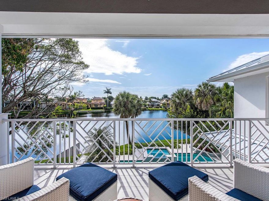 One-half block to 5th Avenue, hidden on a quiet secluded street and overlooking Spring Lake sits a New Construction home offering privacy and every upgraded amenity imaginable! A rare opportunity to walk to the Naples world-class Beach, Shops and Restaurants is within your reach. A large pool with sun shelf, spa, water features and fountains are set against the backdrop of Spring Lake. An interior offering an expansive floor plan with great room and study main level living, master suites both downstairs and up, outdoor kitchen with linear fireplace open to lake views or protected by remote screens and shutters, an Elevator, Wolfe gas cook top, built-in Miele coffee maker, wine service bar, laundry rooms upstairs and down, a grand upstairs fitness game and media center surrounded by 4 en suite bedrooms, wide plank wood flooring throughout and both a sunrise and a sunset balcony over the lake! These are just some of the features. The discerning buyer will appreciate the comfortable elegance, spacious living and Perfect Location to stroll Fifth Avenue, the Third St. District of cafes and art, and a short walk to the beach as you love and live the fabulous, unique Old Naples life!