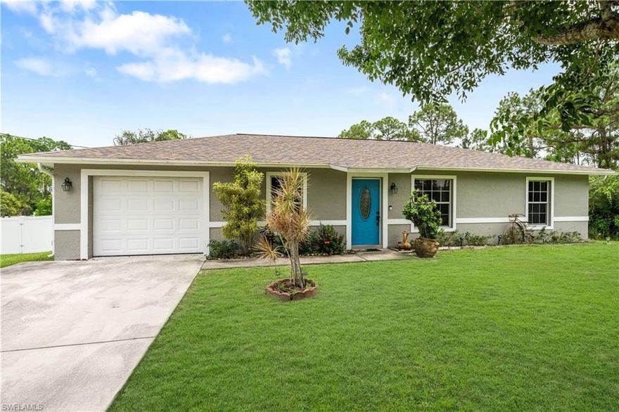 Affordable AND cute as a button! Take a look at this well maintained, 3 bedroom 2 bathroom home in Lehigh Acres. Feeling much larger than it is, this home is laid out perfectly to accommodate a family. Work from home? No problem! High speed internet is available in this area. The newer, vinyl wood-look flooring throughout the home is perfect for those with kids or furry pets. The oversized, half acre lot features a new privacy fence and is loaded with beautiful, mature oak trees. The roof was replaced in 2018, so you will save money on your homeowner's insurance. There's also an electrical plug installed, should you want to hook up a generator to keep your power going during a storm, should the electricity go out. Opportunity awaits, but not for long in this aggressive real estate market. Make a smart investment today!