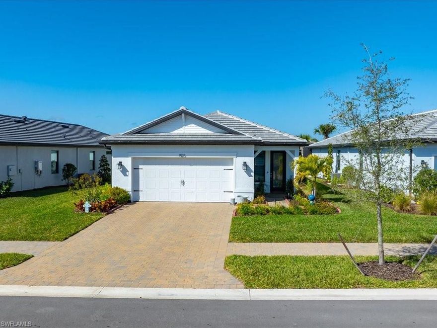 Why wait to build when you can move right into a nearly new home and start enjoying the Naples lifestyle today?Imagine waking up each morning in a home that feels like a private retreat, makes everyday living feel effortless, and surrounded by resort-style amenities. Located within the gated community of Terreno at Valencia, this nearly new single-family residence offers a rare opportunity to enjoy modern construction, thoughtful upgrades, and a true resort-style lifestyle in one of Naples’ newest communities. Less than one year old, the home features over 1,650 square feet of bright, open living space with 3 bedrooms, 2 bathrooms, and an oversized extended 2-car garage designed for both comfort and convenience. The heart of the home is an inviting open kitchen where clean design meets functionality, showcasing white shaker cabinetry with dove-tailed soft-close drawers and doors, pull-out lower cabinets, quartz countertops, and stainless steel appliances. Porcelain tile flooring flows throughout, creating a seamless, low-maintenance living environment ideal for Florida living, while custom built-in closet systems bring organization and ease to every space. Beyond your front door, and just a short one-minute walk away, Terreno at Valencia offers an amenity experience that feels more like a private resort — a vibrant clubhouse with social spaces and catering kitchen, fitness center and exercise studio, event lawn, on-site casual outdoor bar/restaurant dining, fire pits, and a stunning resort pool with lap lanes and spa. Pickleball and tennis courts provide endless opportunities to stay active and connected. Whether spending mornings in the sunshine, afternoons by the pool, or evenings with friends and neighbors, this home offers more than a place to live — it offers the lifestyle buyers come to Naples to find. With furnishings negotiable, you can begin enjoying your Naples lifestyle from day one.