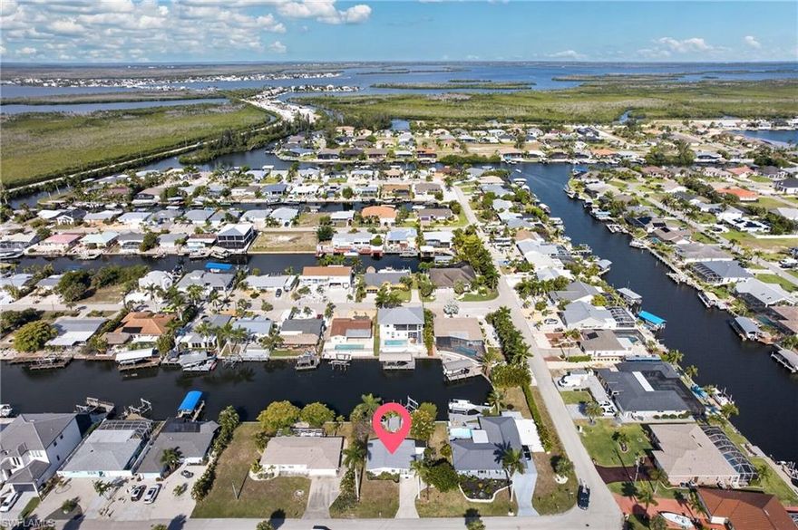 Waterfront living in the heart of Matlacha Isles! DIRECT GULF ACCESS! This beautifully maintained home at 12307 Matlacha Blvd offers an exceptional boater’s lifestyle with a recently built, oversized deck/dock—one of the nicest in the neighborhood. Features include a 16,000 lb Golden lift for a 35’ boat, davits for a second vessel, and side-tie space for an additional 35’+ boat. Dock is equipped with water, electric, and ample space for entertaining, outdoor cooking, and relaxing.The home has been thoughtfully updated over 20 years of ownership, including a remodeled kitchen with stainless steel appliances, new 2025 mini-split AC/heat systems, and a full 2026 CPVC replumb from the street for added peace of mind. Mature trees and lush landscaping create a private, established setting. This would make the perfect Florida getaway!