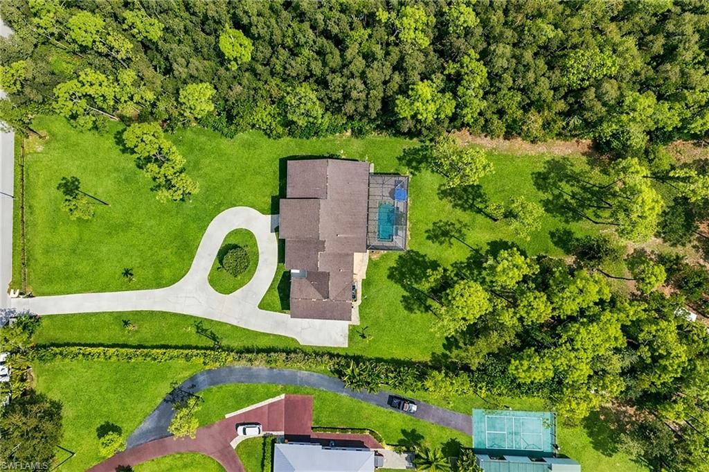 Photo of 5790 Standing Oaks LN, NAPLES, FL 34119 (MLS # 226011902)