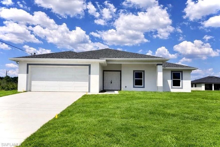 Brand New Home located in Northwest Lehigh on a CORNER LOT on a QUIET LOW TRAFFIC STREET, MOVE IN READY 3 BEDROOM 2 BATH WITH A DEN with a closet that may be used as 4TH BEDROOM. C.O. HAS BEEN ISSUED, double door entry to the den for privacy, 32 X 32 POLISHED PORCELAIN TILE FLOORS THROUGHOUT  with 5 inch baseboards, impact resistant windows, covered front porch leads to large great room, cathedral ceilings throughout with tray ceilings in the master bedroom, shaker cabinets with soft close doors and drawers, pendant lighting over breakfast bar, QUARTZ TOPS in kitchen and baths, stainless steel appliance package, pantry, large dining area off of the kitchen, spacious master bedroom with walk in closet, private bath with dual sinks and tiled walk in shower, walk in closet in guest bedroom, indoor laundry room, covered porch in rear overlooking the backyard with plenty of privacy, double garage with auto opener, extra long driveway with plenty of parking, excellent location just minutes to I-75 and Ft Myers and SWFL International Airport. NO FLOOD INSURANCE REQUIRED HERE. LEHIGH IS THE HIGHEST ELEVATION IN LEE COUNTY.