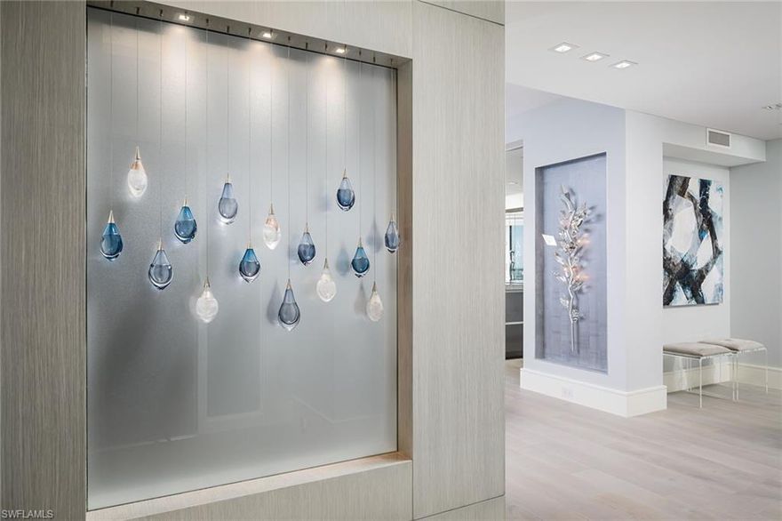 This exquisite Gulf of Mexico penthouse was fully gutted and reconstructed to create open living, dining, kitchen areas. It is offered turnkey. Residence captures the full essence of life on the beach and offers stunning evening views of “city” lights. Architecturally designed with “Manhattan on the beach” as the theme. Utilizes imported stone/Carrera marble/quartzite to maximize views and use of light. Minimalist style features artwork from distinguished local artisans, custom furniture from Italy, custom imported cabinetry, custom high-tech panels to control ambiance, 2 bars, glass-enclosed study/office to afford panoramic views of both the beach and Naples Bay/Venetian Village. Two assigned garage parking spaces. Building update scheduled to be substantially completed by end of 2023. Amenities: 2 guest suites, 24-hour manned front desk, heated pool and spa overlooking the Gulf of Mexico, club/card room/library, exercise/fitness, billiards, entertainment room, tennis and more. Located in the Park Shore beach community, minutes to Old Naples, fine dining, shopping, and cultural activities. Naples private airport is minutes away, the international airport is about 30 minutes away.