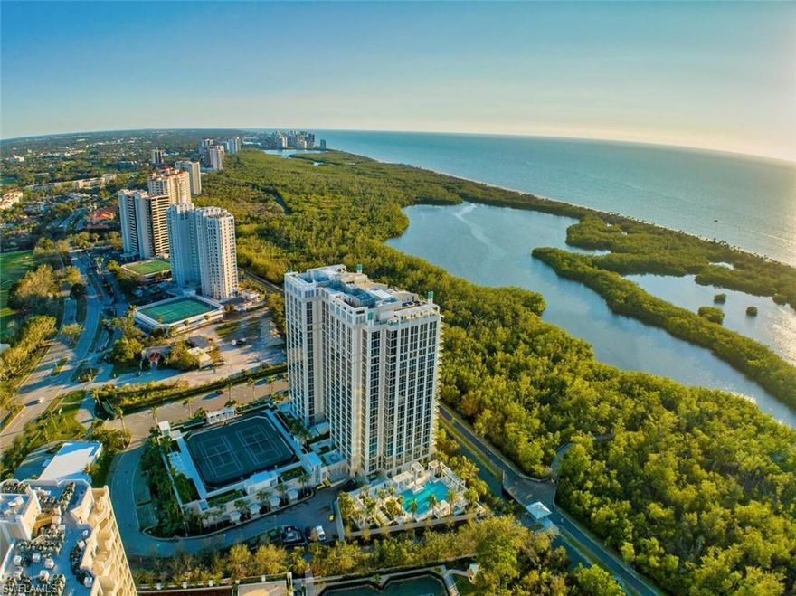 Welcome to Mystique, Pelican Bay’s most spectacular luxury high rise.  Built in 2019, it boasts all the latest hurricane standards and the layout and amenities for the most discriminating buyer.  From this rarely available 18th floor end unit, enjoy expansive views of the Gulf of Mexico and sunsets from floor to ceiling windows.  The lanai has glass railings and automated shutters. A private elevator leads to this beautiful home with 5 bedrooms plus den and 4.5 baths.  The open kitchen has gorgeous Calcutta countertops with large island, Wolf and Subzero appliances, and white shaker cabinets. The great room has both formal and informal dining, a separate living room with a free-standing fireplace, Brazilian hardwood floors and coffered ceilings. The master bath has marble tile, dual sinks, separate tub and shower, and walk-in closets.  Mystique provides concierge services and 24-hour staff. Building amenities include: pool/spa, social rooms, billiards, spa suites, board room, fitness, two tennis courts, movie theater, and guest suites. Take a private tram to Pelican Bay’s two exclusive beach restaurants. Act fast as this gem won’t last!