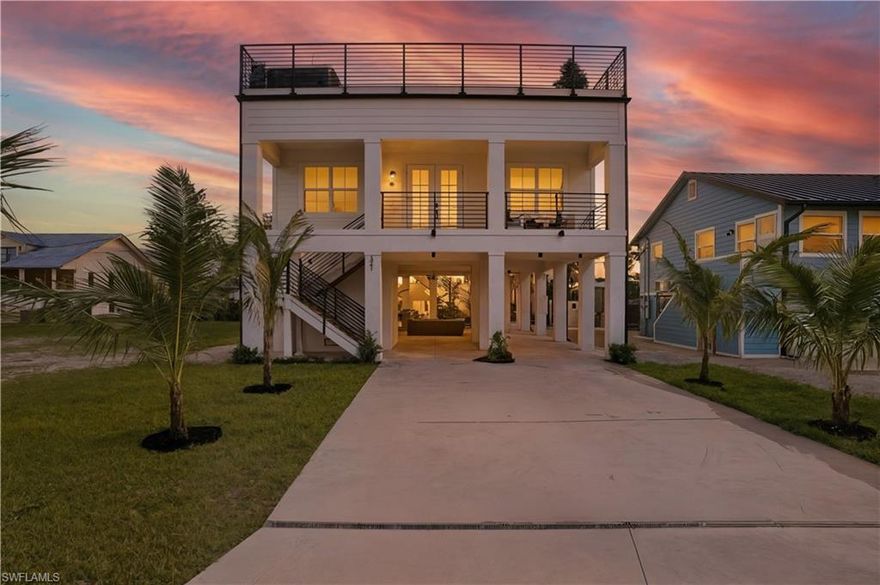 Welcome to this stunning, elevated NEW CONSTRUCTION home on Fort Myers Beach! Discover coastal luxury living at its finest in this mid-island location, perfectly situated on a weekly rental homesite, just steps to Publix and Snook Bight Marina. Designed for both comfort and elegance, this property boasts high-end finishes throughout, including quartz countertops, porcelain floor tile, custom closets, and luxury light fixtures and accessories.  The home comes fully furnished for a truly turnkey experience. Enjoy breathtaking views of the Gulf of Mexico and Southwest Florida sunsets from your private rooftop with luxury patio furniture and hot tub.  All this makes for an ideal space for entertaining guests, or relaxing in paradise under the stars. The open-concept layout seamlessly blends indoor and outdoor living, creating a bright and airy atmosphere. Whether you’re looking for a personal retreat or an a turn key investment opportunity, this home offers the perfect blend of luxury and location on Fort Myers Beach. Use it some-rent it some, the choice is yours! Public beach access is down the street at Newton Park and the Publix Shopping Plaza and Snook Bight Marina also include access to Junkanoo Below Deck and Fresh Catch Bistro, two of FMB's top restaurant destinations.