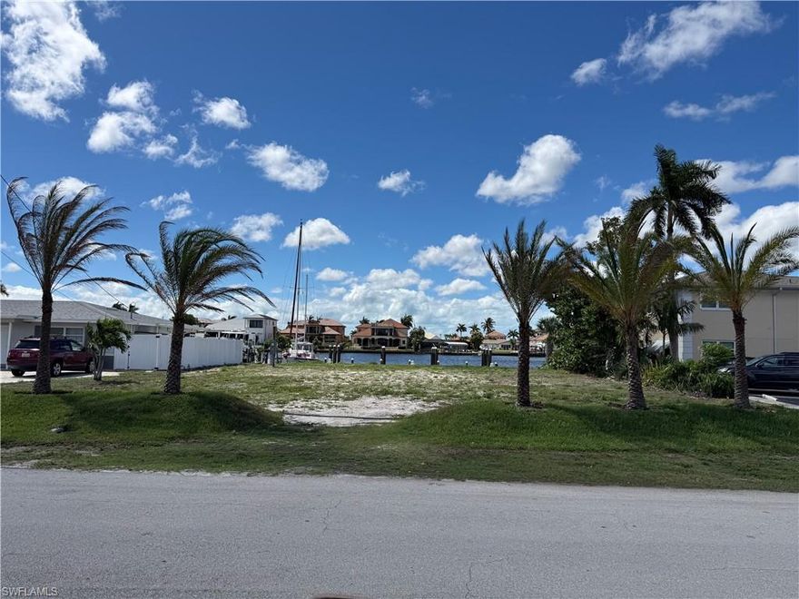 Create an exceptional and truly rare waterfront investment opportunity on this direct Gulf access homesite overlooking Cape Coral’s highly desirable Bikini Basin. Zoned for multi family development, this property represents a limited and increasingly hard to find opportunity to build a duplex or larger income producing waterfront project in one of the city’s most coveted boating corridors. Featuring 80 feet of newly constructed seawall, the lot offers wide, uninterrupted basin views, deep water, and fast, direct access to the river.

Purpose built for the boating lifestyle and future tenants, the property includes true sailboat access along with three private wet slips, each fully outfitted with 240V 50 amp shore power service and water hookups, an extremely uncommon amenity package that significantly elevates both functionality and long term value.

Ideally located just off the Cape Coral Bridge, the property provides convenient access to Fort Myers while maintaining a quiet, private waterfront setting. Just across the bridge, the newly opened Slipaway Food Truck Park and Marina adds a vibrant and walkable waterfront destination with dining, live music, and a lively social atmosphere just minutes away.

You are also only a short 10 minute bike ride from the Cape Coral Yacht Club and beach, currently undergoing a transformative 100 million dollar redevelopment.

The lot is cleared and ready for construction, offering a truly rare, near irreplaceable opportunity for immediate development in one of Cape Coral’s premier waterfront settings.