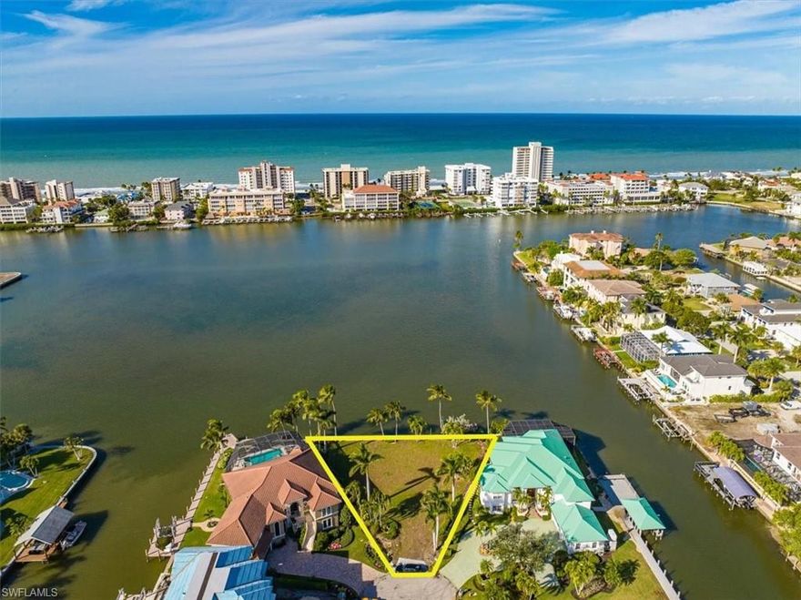 Stunning unobstructed views with West exposure over the Bay at Conners in Vanderbilt Beach at this end of the cul-de-sac lot offering over 1/3 acre with private wood dock.  Build your dream home and enjoy direct access to Wiggins Pass and the Gulf of Mexico.  Close to Vanderbilt Beach, Vanderbilt and Mercato destinations where you will find superior shopping opportunities and an array of restaurants. Easy access to downtown Naples for Fun on Fifth.
With 172 feet of bay frontage, your imagination can soar as you work with your architect to design your perfect new home and bay front oasis.