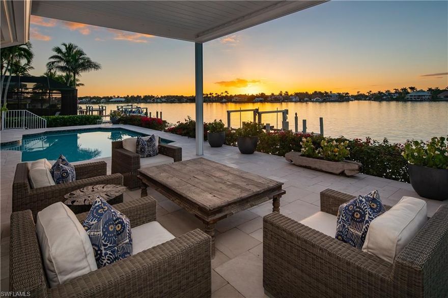 Enviably set in a sought-after waterfront location overlooking spectacular bay vistas, this completely remodeled home is a must see. Experience idyllic indoor-outdoor living with a stunning interior defined by high-end finishes and impressive entertainment areas. Walls of glass spill abundant natural light across the open layout, and a desirable western exposure allows you to enjoy vibrant sunsets from the comfort of your living room. Top-of-the-line stainless steel appliances, stylish cabinetry, and an oversized island with seating inspire the avid cook to create gourmet meals. Indulge in ultimate relaxation in the chandelier-lit primary suite displaying a generous walk-in closet and a spa-like ensuite with a freestanding soaking tub and a zero-entry shower. When you're not taking a dip in the pool, explore all this boater's dream haven has to offer, like 100-feet of water frontage, a boat dock, and direct access to the Gulf of Mexico. Dining, shopping, and entertainment options along downtown 5th Avenue South and 3rd Street South are conveniently nearby. Plus, you’re close to white sand beaches. Come grab the rare opportunity to call this remarkable residence yours.