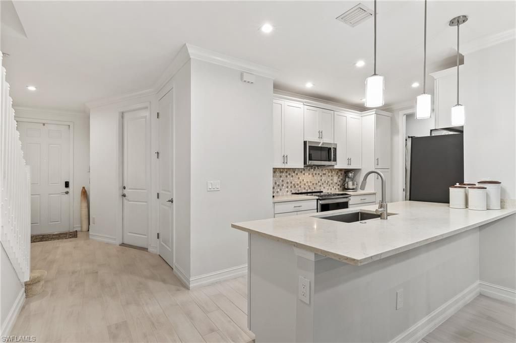 Photo of 7344 Rockefeller DR, NAPLES, FL 34119 (MLS # 226007805)