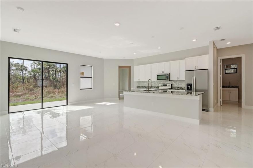 READY TO MOVE IN 45 DAYS!!! Spacious open floor plan with 3 spectaculars bedrooms, 2 baths, and 2 cars garage. The driveway goes all the way down to the double garage entry door. Situated on 2.27 acres. This home also features granite counter tops, custom wood cabinets, stainless steel appliances, tile floor and more amenities and features. This street has a dead end road which offers peace and quiet along with added safety for the family. Plenty space to park your toys in the backyard. This property is just what you're looking for. Don't miss the opportunity to own house for only minutes away from Ave Maria University & the Naples beaches. Come see this beautiful property. Make this your dream home now. The builder has more homes being built at this time. PHOTOS ARE TAKEN FOR SIMILAR CONSTRUCTION !!! Ready to move in MARCH!!!