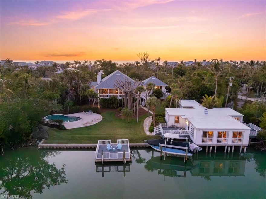 A one of a kind offering with 150ft of water frontage laden with rich national history. President Theodore Roosevelt began frequenting Captiva in 1908. In 1917 he staged his houseboat at this very location for his legendary Devil Fish expedition of which he hunted and gathered for the Smithsonian. In the 1930s this property served as one of only two locations to deliver goods to Captiva mainly of which was building materials, delivered by barge. The oversized grandfathered dock was built in 1939 by the WPA which was founded by Franklin Roosevelt. The romantic boathouse, which is cantilevered over the water and is also grandfathered in, was constructed in 1953 by Harold Bixby. Bixby was one of Charles Lindbergh's primary backers in 1927 when Lindbergh accomplished his transatlantic flight in The Spirit of St Louis. The boathouse with two bedrooms and caretaker cottage with one bedroom stand today in superb condition with a recently installed composite roof with a 100 year life expectancy. As you approach the main house, you are greeted with the charm of olde world Southern architecture. Inside you will find soaring ceilings of cypress, and beautiful views of Roosevelt Channel along with three spacious bedrooms, a library and an office. Resting on over 1.3 acres with deeded beach access.