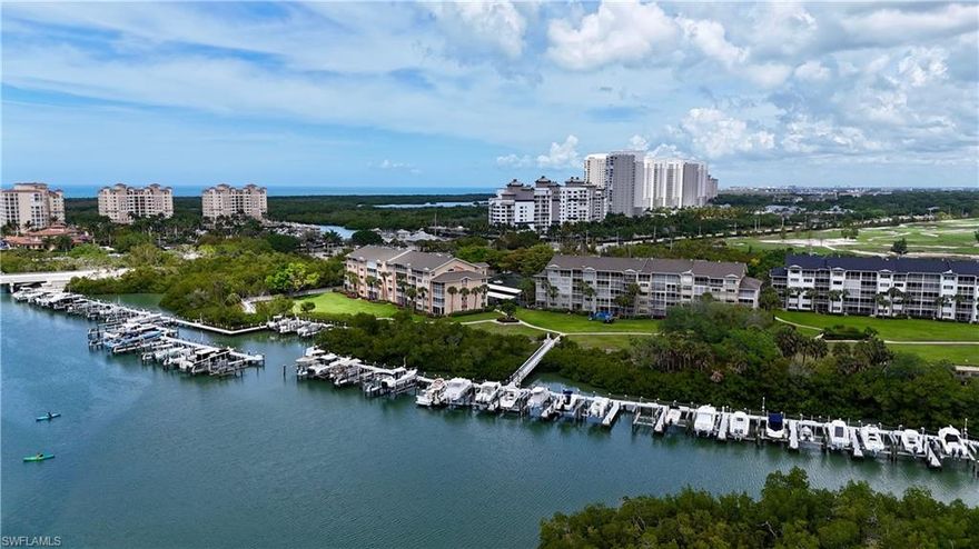 Rarely available fourth-floor residence capturing expansive, unobstructed bay and lake views from a coveted southern exposure in the gated community of Princeton Place at Wiggins Bay. Offered fully furnished, this 2-bedroom, 2-bath condo presents a truly turnkey opportunity with natural light filling the interior throughout the day. The elevated vantage point delivers tranquil water vistas and stunning sunset reflections, best enjoyed from the screened lanai with electric shutters.
Inside, the open-concept living and dining area is designed to maximize the view, creating an inviting space for everyday living and entertaining against a scenic waterfront backdrop. The kitchen features granite countertops, breakfast bar and a comfortable eat-in nook. Recent improvements include new bathroom vanities with quartz countertops, a new HVAC system (2026), water heater (2025), PEX plumbing, and an impact window in the primary bedroom. The residence includes one assigned carport space along with ample guest parking. Residents enjoy 24-hour gate-controlled access and an active social setting with frequent building and community events.
Ideally located in North Naples, west of U.S. 41, Princeton Place offers convenient access to Gulf beaches, premier shopping and dining, Mercato, Coconut Point, and local entertainment, with Southwest Florida International Airport approximately 30 minutes away. Optional membership to Tarpon Cove Yacht & Racquet Club provides resort-style amenities including a private beach shuttle to Delnor-Wiggins Pass State Park, tropical pool with tiki bar, fitness center, Har-Tru tennis courts, bocce ball, multiple dining venues, and a full calendar of social events. Nearby boat docks offer easy access to the Gulf of Mexico for boating enthusiasts.