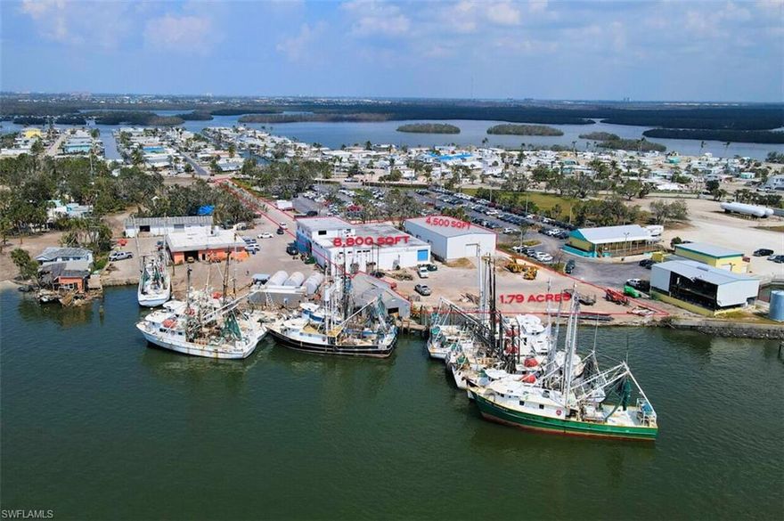 Rare Opportunity to own a Large Waterfront Commercial property on a Deep Water Federal Channel with quick access to the Gulf. Zoned as IPD (Industrial Planned Development) under Lee County Zoning and is listed as Industrial Development under Lee County Zoning Future Land Use Map. Allowing for a wide range of uses (Retail, Boat Dockage and Storage). Property has been under the same ownership for nearly 30 Years. Subject Property consists of approximately 1.79 acres (77,929 Sq. Ft.) of Uplands with approximately. 0.549 Acres (23,914 Sq. Ft. of Submerged Lands under a State Submerged Land Lease with the State of Florida) and has 2 existing buildings on it. Bldg1 is a concrete building built in 1980 that once served as an Seafood Restaurant and combination Shrimp Processing/Packing plant and Warehouse approximately 8,880 Sq. Ft. Bldg.2 is a Steel Frame Building built in 2007 and is approximately 4,500 Sq. Ft. and was used as a warehouse. Building's, Docks and Seawall do have damage caused by Hurricane IAN .