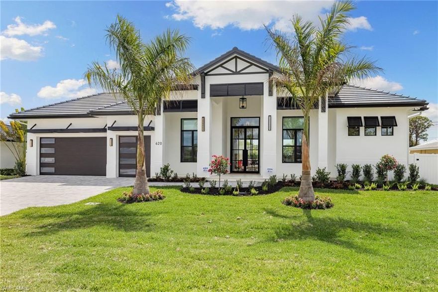 This remarkable new construction home sets a new standard for Naples Park.  Upon arrival, a striking double iron-and-glass main entry door sets the tone for what lies within. Light-filled interiors unfold beneath soaring ceilings—reaching up to 21 feet—revealing four beautifully proportioned bedrooms, a private study, and 4.5 thoughtfully designed baths. The dramatic great room, anchored by a warm fireplace, balances grandeur with comfort, creating an inviting space for everyday living and elegant entertaining. Every detail reflects exceptional craftsmanship, from the Thermador appliances and gas range to the handcrafted brass custom range hood, Cristallo and Pompeii quartz countertops, dual gas instant hot water heaters, and impeccable luxury finishes throughout.
A resort inspired outdoor space features a custom pool with spillover spa, gentle waterfalls, outdoor shower, expansive sun deck, and an intimate gas fireplace create a setting for relaxed days and unforgettable evenings beneath the Florida sky. The fully equipped outdoor kitchen with gas grill makes entertaining effortless, while the home’s coveted southern exposure fills every space with natural light year-round.
This home is offered fully furnished with exquisite, high-quality selections from Arhaus and Robb & Stucky. All bedrooms feature custom window treatments, and TVs with Sonos sound bars are placed throughout the home for seamless living. And for peace of mind, the home includes a full-house 24kW generator, a 1,000-gallon underground propane tank, and a security camera system.  Located just moments away from the white sand of Vanderbilt Beach, the iconic new Ritz-Carlton Residences, and the charm of Mercato offering premier restaurants, boutique shopping and a vibrant night life.  This home is truly Naples at its finest.